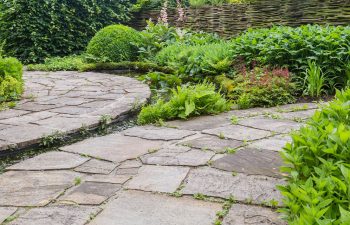 A professionally landscaped garden with hardscapes and water features.