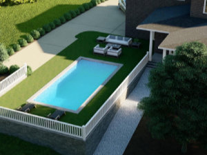 A rectangular backyard pool is surrounded by a white fence, with lounge chairs and a patio seating area on grass next to a house.
